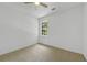 Bedroom features carpet, a ceiling fan, and a large window at 3243 Northbrook Dr, Atlanta, GA 30341