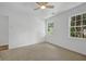 Bedroom featuring carpet, a ceiling fan, and two large windows at 3243 Northbrook Dr, Atlanta, GA 30341