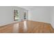 Spacious bedroom with hardwood floors, two windows, and white walls and trim at 3243 Northbrook Dr, Atlanta, GA 30341