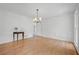 Bright dining room with hardwood floors, modern lighting, and classic wall trim at 3243 Northbrook Dr, Atlanta, GA 30341