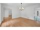 Hardwood floors, classic wall trim, and modern lighting in this open dining room at 3243 Northbrook Dr, Atlanta, GA 30341