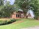 Traditional two-story brick home with black shutters and mature landscaping at 3243 Northbrook Dr, Atlanta, GA 30341