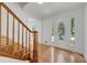 Bright foyer with hardwood floors, decorative trim, and staircase with wood banister at 3243 Northbrook Dr, Atlanta, GA 30341