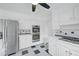 Kitchen featuring stainless steel appliances, white cabinets, and a tile backsplash at 3243 Northbrook Dr, Atlanta, GA 30341