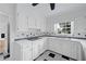 Classic kitchen with white cabinets, checkered floors, and sleek countertops at 3243 Northbrook Dr, Atlanta, GA 30341