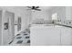 Spacious kitchen with stainless steel appliances, white cabinets, and checkered flooring at 3243 Northbrook Dr, Atlanta, GA 30341