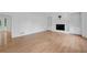 Bright living room featuring hardwood floors, fireplace, built-in shelving, and ample space at 3243 Northbrook Dr, Atlanta, GA 30341
