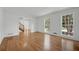 Large living room with gleaming hardwood floors, bright windows, and decorative trim at 3243 Northbrook Dr, Atlanta, GA 30341
