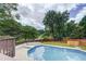 An outdoor view of the pool and the surrounding green and wooded areas at 3243 Northbrook Dr, Atlanta, GA 30341