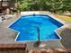 Refreshing in-ground pool featuring stairs and a diving board at 3243 Northbrook Dr, Atlanta, GA 30341