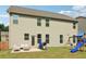 Exterior view of the backyard featuring a patio with furniture, grill and playset at 4172 Cedar Commons Way, Conley, GA 30288