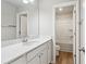 Bathroom featuring a white vanity with modern fixtures and access to the shower at 4172 Cedar Commons Way, Conley, GA 30288