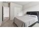 Bedroom featuring neutral tones, closet, and a serene ambiance for relaxation at 4172 Cedar Commons Way, Conley, GA 30288