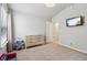 This spacious bedroom features neutral walls, a window, tv, and a door to another room at 4172 Cedar Commons Way, Conley, GA 30288