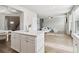 Bright, open-concept kitchen and living area with an island, light wood floors and neutral color palette at 4172 Cedar Commons Way, Conley, GA 30288