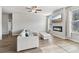 Cozy living room features a modern fireplace, large TV, hardwood floors, and ample natural light at 4172 Cedar Commons Way, Conley, GA 30288
