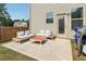 Back patio with furniture and a grill at 4172 Cedar Commons Way, Conley, GA 30288
