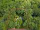 Aerial view of property in a wooded area, highlighted by a property line at 120 Majesty Ln, Fayetteville, GA 30215