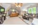 Bonus room with a vaulted ceiling, carpet floors, ladder bookshelf, and window views at 120 Majesty Ln, Fayetteville, GA 30215
