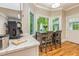 Cozy breakfast nook with hardwood floors and windows overlooking the lush greenery at 120 Majesty Ln, Fayetteville, GA 30215