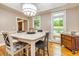 Dining room with hardwood floors, neutral walls, natural lighting, and views to the front yard at 120 Majesty Ln, Fayetteville, GA 30215