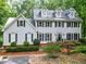 Large two-story home with manicured landscaping, dormer windows, and a spacious front yard at 120 Majesty Ln, Fayetteville, GA 30215