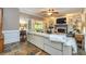 Spacious living room features custom built-ins, slate floors, and access to the sunroom at 120 Majesty Ln, Fayetteville, GA 30215