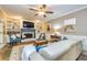 Inviting living room with a cozy fireplace, custom built-ins, and ample natural light at 120 Majesty Ln, Fayetteville, GA 30215