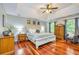 Tranquil main bedroom with trey ceilings, hardwood floors, and a sitting area at 120 Majesty Ln, Fayetteville, GA 30215