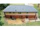 A large backyard of a two story home featuring a lawn and a sitting area on the lower level at 2468 Dresden Ne Dr, Atlanta, GA 30341