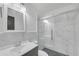Modern bathroom featuring a glass-enclosed shower and sleek vanity at 2468 Dresden Ne Dr, Atlanta, GA 30341