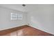A bright bedroom features hardwood floors and a window offering natural light at 2468 Dresden Ne Dr, Atlanta, GA 30341