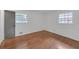 This bright bedroom has hardwood floors and two windows that provide natural light at 2468 Dresden Ne Dr, Atlanta, GA 30341