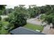 View of a home from above, showing the roof, yard, and the trees surrounding the property at 2468 Dresden Ne Dr, Atlanta, GA 30341