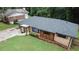 View of the front of the home featuring a well maintained lawn and a small patio with wood columns at 2468 Dresden Ne Dr, Atlanta, GA 30341