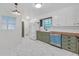 A modern kitchen with butcher block countertops, stainless steel appliances, and bright white and green cabinets at 2468 Dresden Ne Dr, Atlanta, GA 30341