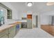Renovated kitchen featuring custom cabinets, modern appliances and hardwood countertops at 2468 Dresden Ne Dr, Atlanta, GA 30341