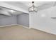 Spacious living room with neutral paint and contemporary lighting at 2468 Dresden Ne Dr, Atlanta, GA 30341