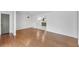 Hardwood floors throughout a living room open to the updated kitchen space at 2468 Dresden Ne Dr, Atlanta, GA 30341
