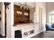 Custom wet bar with rustic wood accents, stylish lighting, and ample storage, creating a cozy entertainment space at 2917 Ashebrooke Ne Dr, Marietta, GA 30068