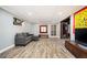Basement featuring luxury vinyl plank flooring, comfortable seating, and an entertainment center at 2917 Ashebrooke Ne Dr, Marietta, GA 30068