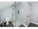 Contemporary bathroom featuring a glass shower enclosure, modern toilet, and tiled flooring at 2917 Ashebrooke Ne Dr, Marietta, GA 30068