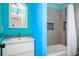 Brightly painted bathroom with a modern vanity, mosaic tiles, and tiled shower with a curtain at 2917 Ashebrooke Ne Dr, Marietta, GA 30068