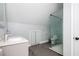 Modern bathroom with sleek vanity, glass-enclosed shower, tiled floors, and stylish fixtures at 2917 Ashebrooke Ne Dr, Marietta, GA 30068