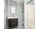 Stylish bathroom with a modern vanity, elegant mirror, and a sleek glass shower door at 2917 Ashebrooke Ne Dr, Marietta, GA 30068