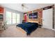 Bedroom featuring a brick accent wall, natural light, and carpet at 2917 Ashebrooke Ne Dr, Marietta, GA 30068