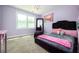 Charming bedroom with light purple walls and plush carpeting at 2917 Ashebrooke Ne Dr, Marietta, GA 30068