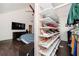 A custom walk-in closet with shelving displays shoes and hanging clothes at 2917 Ashebrooke Ne Dr, Marietta, GA 30068