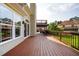 Wide wooden deck with black railing, glass windows and door, plus an outdoor table and chairs at 2917 Ashebrooke Ne Dr, Marietta, GA 30068