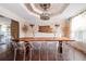 Chic dining room featuring wood table with clear chairs and decorative lighting fixture at 2917 Ashebrooke Ne Dr, Marietta, GA 30068